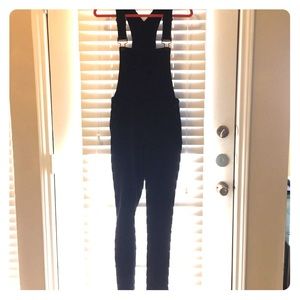 Black full length fashion overalls.